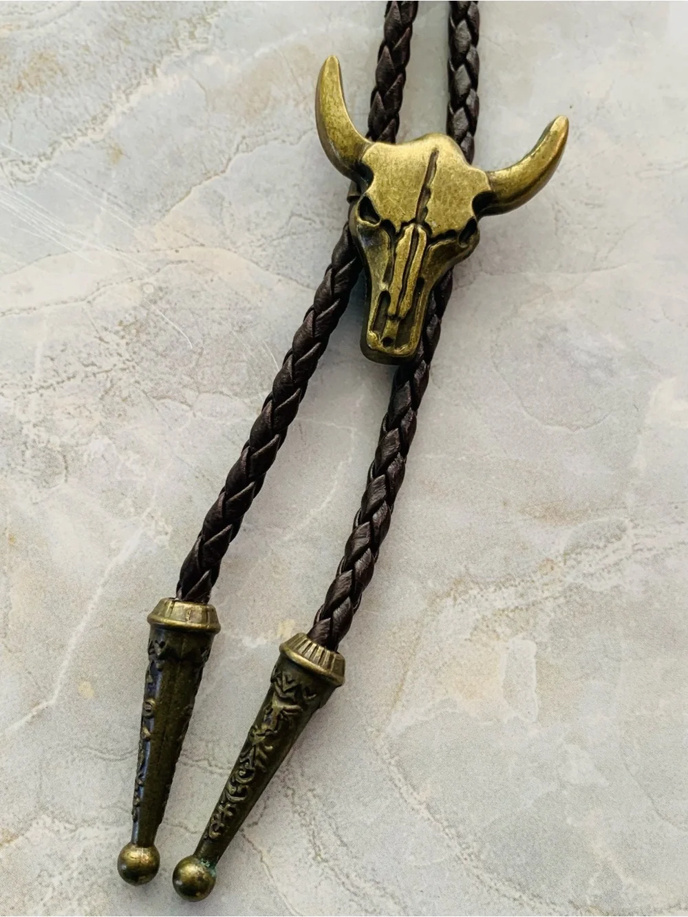 Western Bull Skull Bolo Tie in Brown Leather and Antique Brass